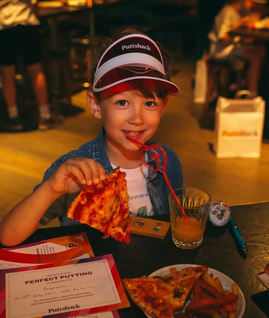 Child eating at Puttshack
